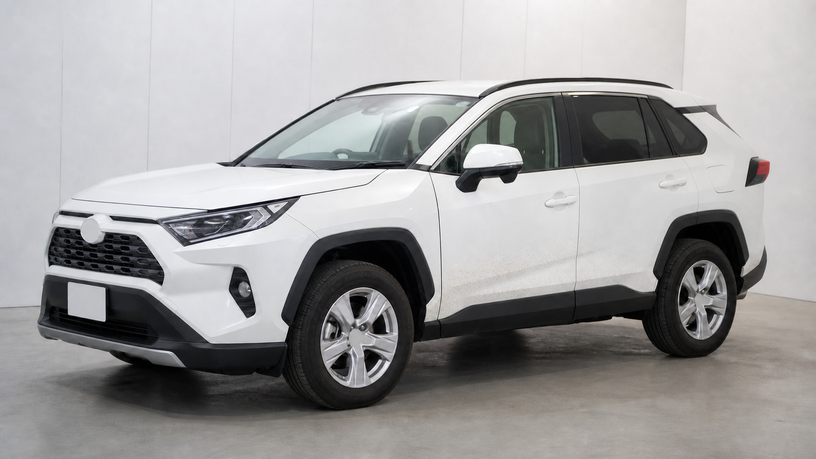 トヨタ RAV4の白いドア下部にある鉄粉のような茶色い点を確認するイメージ